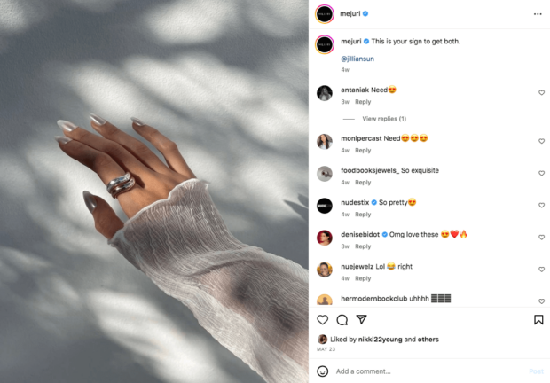 Mejuri jewelry tagged profile of user's photo of hand showcasing rings